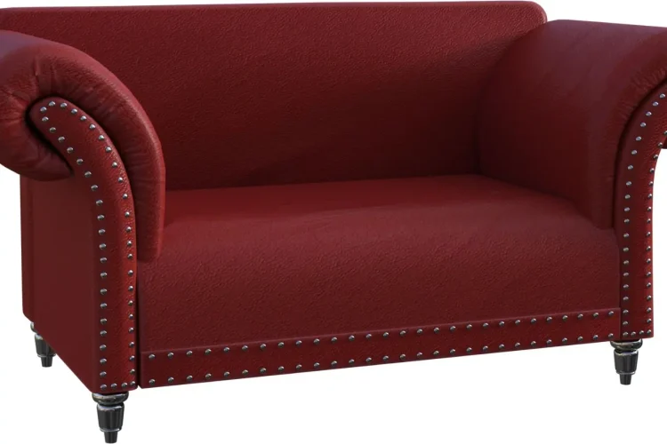 Un canapé en cuir rouge vif, style Chesterfield classique, résistant et intemporel.